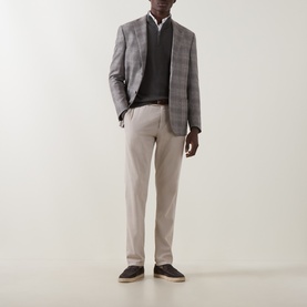 Model wearing Boggi Milano Military Green wool half-zip, styled with grey check blazer, white shirt, and stone chinos.