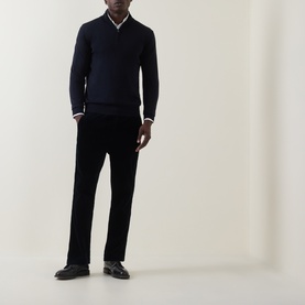 Model wearing Boggi Milano navy blue wool half zip jumper, styled with black straight-leg trousers and black loafers.