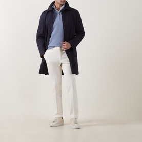 Model wearing Boggi Milano Light Blue Wool Half Zip, styled with a navy overcoat, white trousers, and cream trainers.