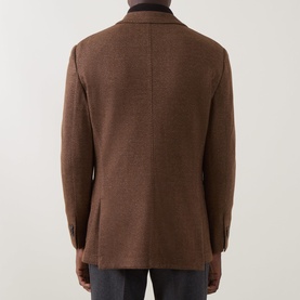 Model wearing Boggi Milano brick red wool-cotton blend jacket, rear view showing tailored back seam and dark collar detail