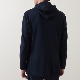 Model wearing Boggi Milano navy blue hooded jacket, back view, relaxed fit with clean seam detailing.