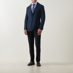 Model wearing Boggi Milano Micro Textured Single-Breasted Blazer in indigo, styled with light blue shirt, dark trousers and derby shoes.
