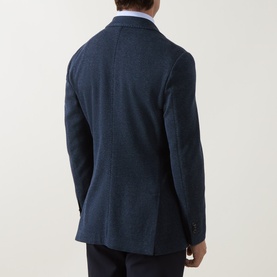 Model wearing Boggi Milano Micro Textured Single-Breasted Blazer in indigo, back view showing rear vents and structured fit, styled with light blue