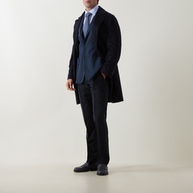 Model wearing Boggi Milano Micro Textured Single-Breasted Blazer in indigo, styled with dark trousers, light blue shirt, and dark leather shoes.