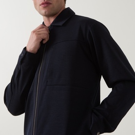 Model wearing Boggi Milano Wool Tech Zip Overshirt in navy blue, showing polo collar and branded two-way front zip fastening.