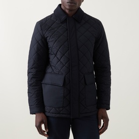 Model wearing Boggi Milano Diamond-Quilted Padded Jacket in navy blue with corduroy collar, snap button placket, and hip flap pockets.