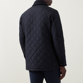 Model wearing Boggi Milano Diamond-Quilted Padded Jacket in navy blue, back view showing quilted pattern and corduroy collar detail