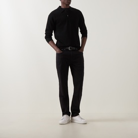 Model wearing Boggi Milano Tech Half-Zip Sweater in black with long sleeves, styled with dark trousers and white trainers.