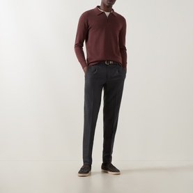 Model wearing Boggi Milano Tech Half-Zip Sweater in Brick Red with dark tailored trousers and a white collar visible beneath.