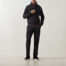 Model wearing Boggi Milano charcoal sweatpants in wool blend, styled with matching zip-up track jacket and dark trainers.