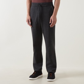 Model wearing Boggi Milano charcoal sweatpants with drawstring waist, paired with dark trainers.