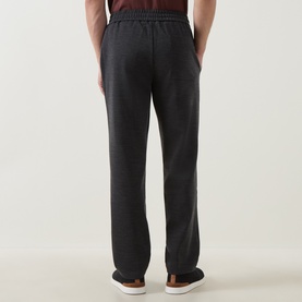 Model wearing Boggi Milano charcoal sweatpants, rear view, relaxed fit with elasticated waist, styled with white trainers.