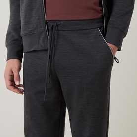 Model wearing Boggi Milano charcoal sweatpants with drawstring waist and side pockets, styled with matching zip-up hoodie and burgundy top.
