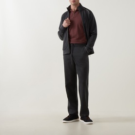 Model wearing Boggi Milano charcoal wool-blend sweatpants, styled with a dark zip jacket, burgundy polo and white-soled trainers.