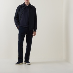Model wearing Boggi Milano Light Scuba Cargo Sweatpants in navy blue, styled with a matching navy harrington jacket and navy trainers.