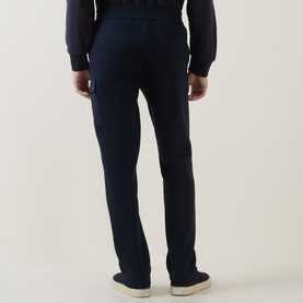 Model wearing Boggi Milano Light Scuba Cargo Sweatpants in navy blue, with elasticated waist and cargo pocket, styled with cream trainers.