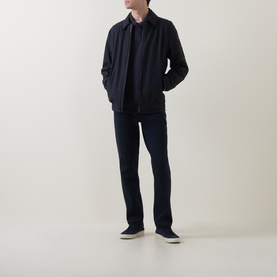 Model wearing Boggi Milano Light Scuba Cargo Sweatpants in navy blue, styled with a matching navy jacket and slip-on shoes.