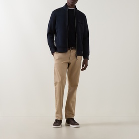 Model wearing Boggi Milano Light Scuba Zip Sweatshirt in navy blue with funnel neck, styled with beige trousers and dark loafers.