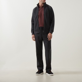 Model wearing Boggi Milano charcoal sweatshirt with zip-through collar, styled with dark trousers and navy suede trainers.