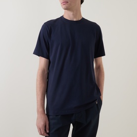 Model wearing Boggi Milano Supima Solid T-Shirt in navy, with round neck and short sleeves, paired with navy trousers.