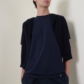 Model wearing Boggi Milano Supima Solid T-Shirt in navy, round neck, short sleeves, styled with a navy jacket and trousers.