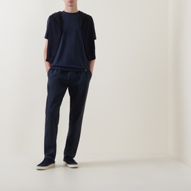 Model wearing Boggi Milano Supima Solid T-Shirt in navy, round neck, short sleeves, styled with navy trousers and dark trainers.