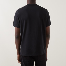 Model wearing Boggi Milano Supima Solid T-Shirt in black, rear view, round neck, short sleeves, straight hemline, styled with black trousers.