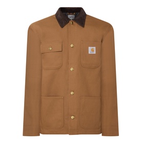 Carhartt casual jacket in Hamilton Brown with dark corduroy collar, gold snap buttons, and chest patch pockets with logo badge