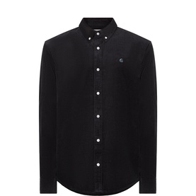 Carhartt Madison Logo Corduroy Shirt in black with button-down collar, long sleeves, logo detail, and curved hemline