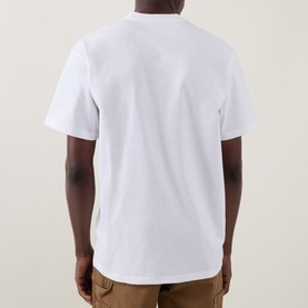 Model wearing Carhartt white crew neck T-shirt, rear view, styled with tan trousers. 100% cotton short-sleeve design.