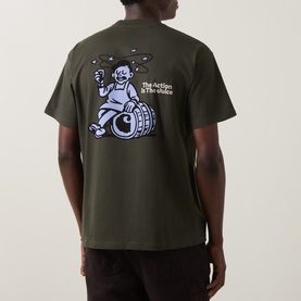 Model wearing Carhartt Crew Neck T in Cypress green, back view showing illustrated barrel graphic with "The Action is The Juice" slogan print.