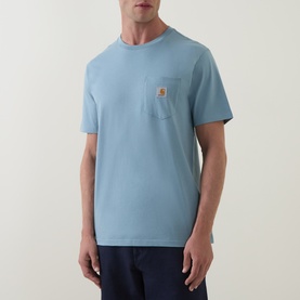 Model wearing Carhartt Crew Neck T in Citadel blue, short sleeves, chest pocket with logo patch, relaxed fit.