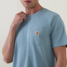 Model wearing Carhartt Crew Neck T in Citadel blue, short sleeves, chest pocket with logo patch, relaxed fit