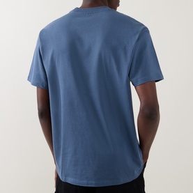 Model wearing Carhartt Crew Neck T in Icesheet blue, rear view, short sleeves, relaxed fit, 100% cotton jersey