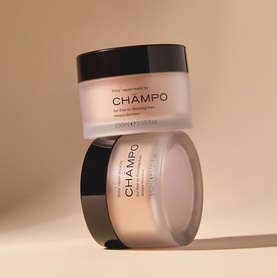 Champo Pitta Repair Mask hair treatment in stacked frosted glass jars with black lids, shown on warm beige background