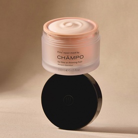 Champo Pitta Repair Mask in a pale pink frosted jar with black lid, shown open to reveal white cream formula.