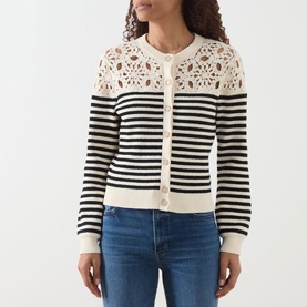Model wearing FRAME DENIM The Coastal Striped Cardigan in Cream Multi with black stripes, crochet shoulder detail, and button fastenings, styled with