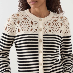 Model wearing FRAME DENIM The Coastal Striped Cardigan in Cream Multi with crochet yoke detailing and button front fastenings.