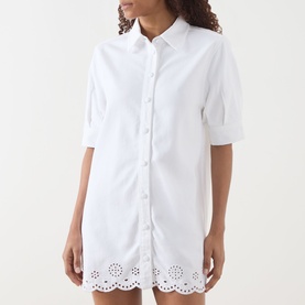 Model wearing FRAME DENIM White Dress with broderie anglaise hem, short sleeves and button-front placket in cotton-lyocell blend.