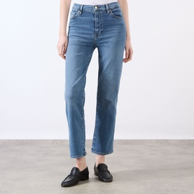 Model wearing FRAME DENIM Straight Jeans in Gossamer blue, cropped ankle length, styled with black leather loafers