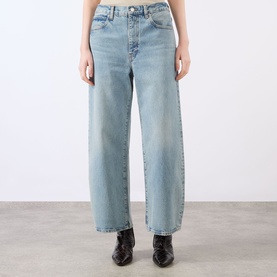 Model wearing FRAME DENIM Straight Jeans in Coastal light blue wash, 100% cotton, with black ankle boots visible below.