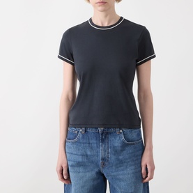 Model wearing Frame Denim navy multi cotton T-shirt with contrast tipped crew neck and short sleeves, styled with light blue jeans.