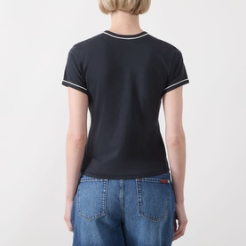 Model wearing FRAME DENIM navy cotton T-shirt, back view, with white tipped crew neck and sleeve hems, styled with blue denim jeans