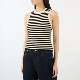 Model wearing FRAME DENIM Coastal Stripe Tank Top in Cream Multi, horizontal black stripes, round neck, sleeveless, styled with dark denim jeans