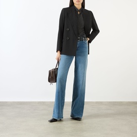 Model wearing FRAME DENIM Le Slim Palazzo High-Rise Wide Leg Jeans in Gossamer, styled with black blazer, dotted top, and black flats.