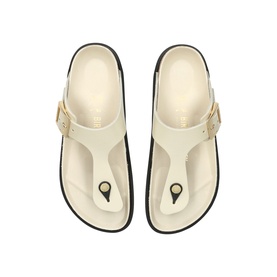 Birkenstock cream T-bar thong sandals with buckle strap, contoured footbed, and dark rubber sole, top-down view