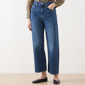 Model wearing Mother Half Pipe High-Rise Ankle Jeans in Did You Bring Me Anything blue wide-leg denim, styled with leopard-print top and black flats.