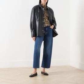Model wearing Mother Half Pipe High-Rise Ankle Jeans in Did You Bring Me Anything, styled with black leather jacket, leopard print top and black