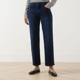 Model wearing Mother Jeans in Chip On My Shoulder dark blue denim, straight leg, styled with a striped top and black ballet flats.