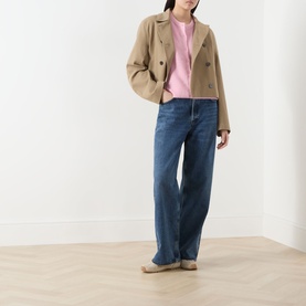 Model wearing Samsoe & Samsoe Saanoura Rib Knit Cardigan in Bleached Mauve, styled with wide-leg blue jeans and a camel cropped jacket.